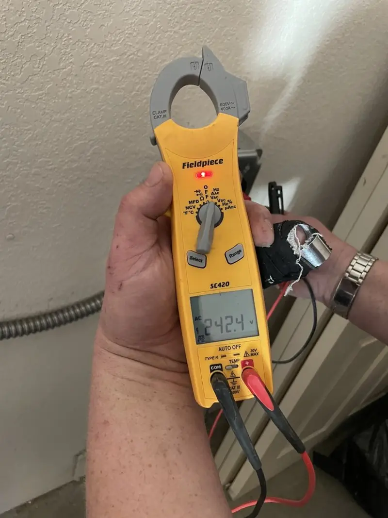 Voltage testing with clamp meter during Ceiling Fan Installation in Norwood Young America
